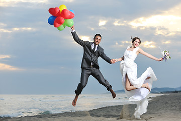 Image showing romantic beach wedding at sunset