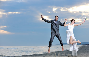 Image showing romantic beach wedding at sunset