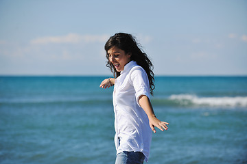 Image showing happy young woman on beach