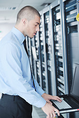 Image showing young it engineer in datacenter server room