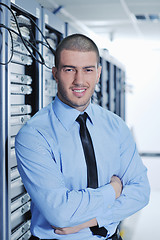 Image showing young it engeneer in datacenter server room