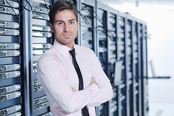 Image showing young it engeneer in datacenter server room