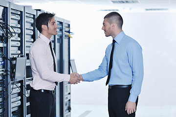 Image showing it engineers in network server room