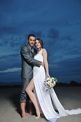 Image showing romantic beach wedding at sunset