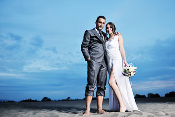 Image showing romantic beach wedding at sunset