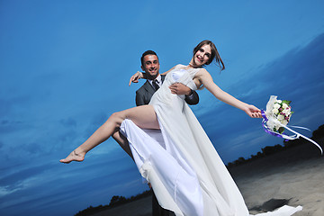 Image showing romantic beach wedding at sunset