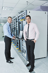 Image showing it engineers in network server room