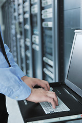 Image showing young it engeneer in datacenter server room