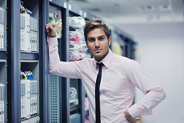 Image showing young it engeneer in datacenter server room