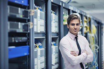 Image showing young it engeneer in datacenter server room