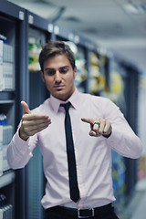 Image showing young it engeneer in datacenter server room