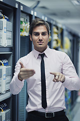 Image showing young it engeneer in datacenter server room