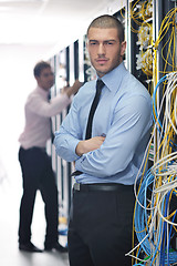 Image showing it engineers in network server room