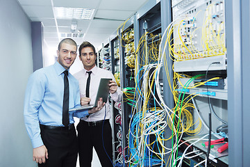 Image showing it engineers in network server room