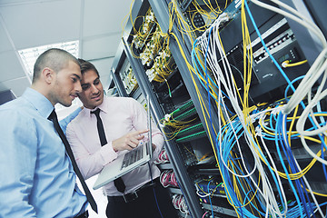 Image showing it engineers in network server room