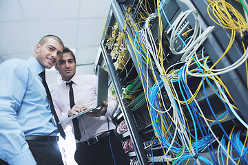 Image showing it engineers in network server room