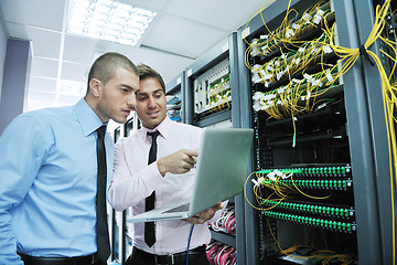 Image showing it engineers in network server room