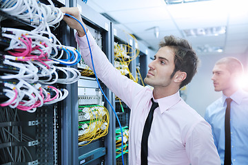 Image showing it engineers in network server room