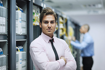 Image showing it engineers in network server room