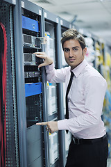 Image showing young it engineer in datacenter server room