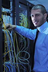 Image showing young it engineer in datacenter server room