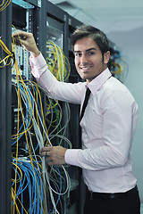 Image showing young it engineer in datacenter server room