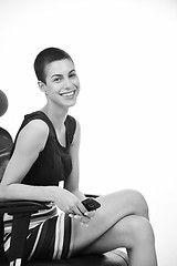 Image showing brunette female  model posing on business chair