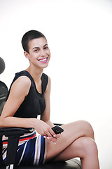 Image showing brunette female  model posing on business chair