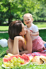 Image showing woman and baby playing at park