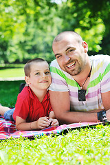 Image showing happy father and son have fun at park