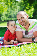 Image showing happy father and son have fun at park