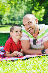 Image showing happy father and son have fun at park