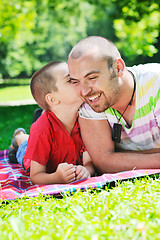 Image showing happy father and son have fun at park