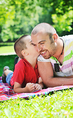 Image showing happy father and son have fun at park