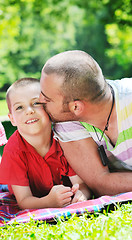 Image showing happy father and son have fun at park