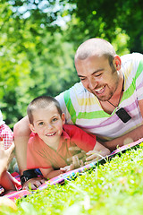 Image showing happy father and son have fun at park