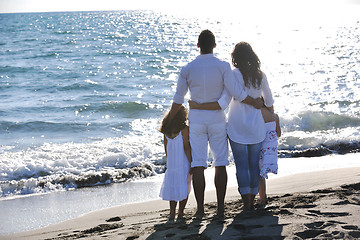 Image showing happy young  family have fun on beach