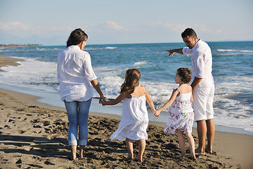 Image showing happy young  family have fun on beach