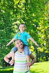 Image showing happy father and son have fun at park