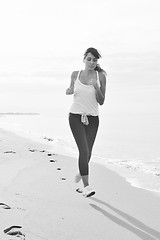 Image showing woman running on beach