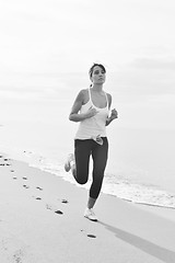 Image showing woman running on beach