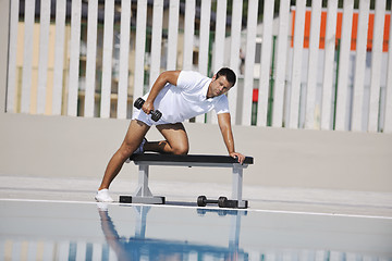 Image showing young man exercise at poolside