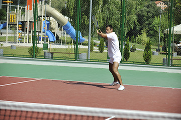 Image showing young man play tennis outdoor