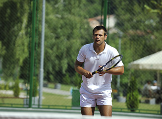 Image showing young man play tennis outdoor