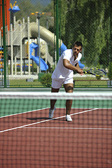 Image showing young man play tennis outdoor