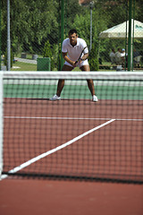 Image showing young man play tennis outdoor