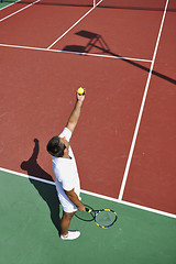 Image showing young man play tennis outdoor