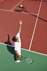 Image showing young man play tennis outdoor