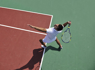 Image showing young man play tennis outdoor