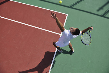 Image showing young man play tennis outdoor